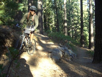 A rider hits the switchbacks on Truckee's JP Trail the easy way — down.