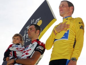 Ivan Basso on podium with Lance Armstrong at 2005 Tour de France awards ceremony in Paris Basso was second at the Tour in 2005