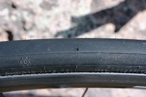 Hutchinson Atom Comp clincher A large cut like this might flat tires with flimsy casings, but this one is still going strong.