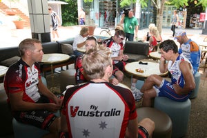 IMG_6640_coffee_shop Robbie McEwen (R) on the phone while enjoying a coffee with his new team-mates in Noosa, Australia.