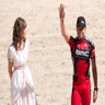 Evans above BMC's Cadel Evans greets the crowd. AFP PHOTO / LIONEL BONAVENTURE