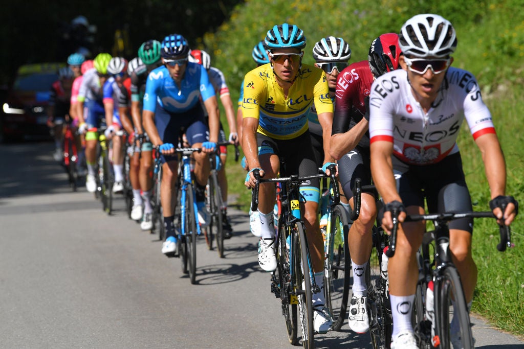CHAMPÉRY, SWITZERLAND - JUNE 16: Michal Kwiatkowski of Poland and Team INEOS / Wout Poels of The Netherlands and Team INEOS / Jakob Fuglsang of Denmark and Astana Pro Team Yellow Leader Jersey / during the 71st Criterium du Dauphine 2019, Stage 8 a 113,5km stage from Cluses to Champéry - Montée de Champéry 1036m / #Dauphine / @dauphine / on June 16, 2019 in Champéry, Switzerland. (Photo by Tim de Waele/Getty Images)