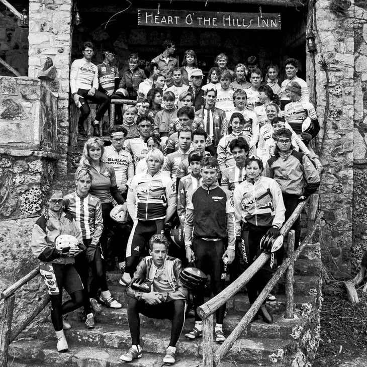 The Future of American Cycling Depends on Donations from Riders Like You 2 Black & white photo of many athletes in cycling gear standing on the steps of the Heart O' the Hills Inn