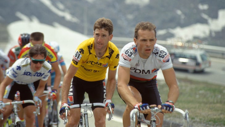 Sean Kelly riding in a group of cyclists in the mountains