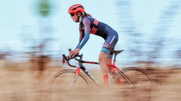 Madigan Munro riding in a field of grass