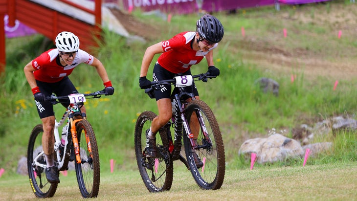 Sina Frei leads teammate Linda Indergand in the women's Olympic cross-country mountain bike race.