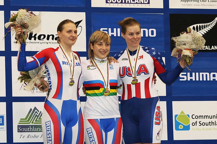Three women on a podium