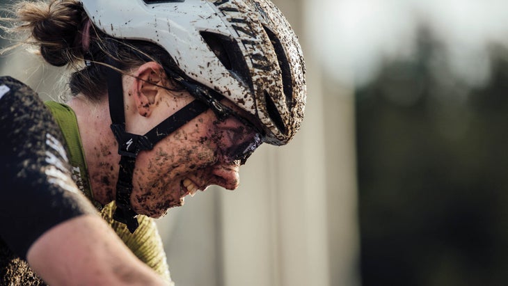 Close-up of Batten's face, covered in mud
