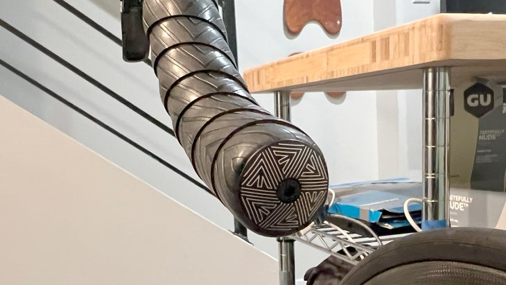 A hex expander bolt keeps the reflective PNW Coast bar-end plug in place.