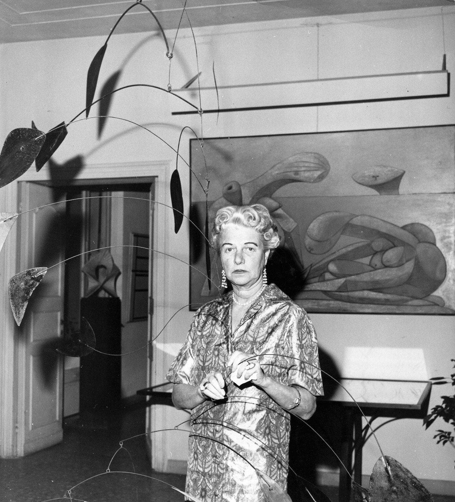 Peggy Guggenheim with a Calder.
