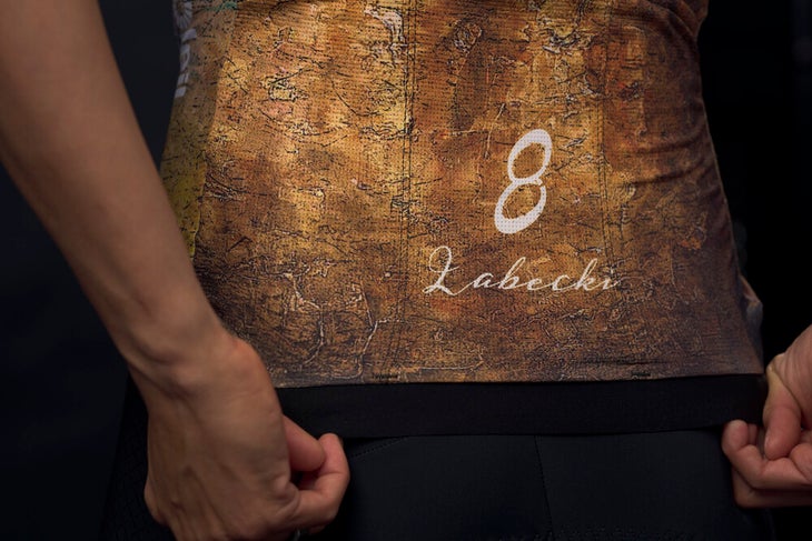 The riders have their names printed on the back