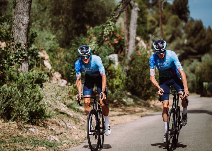 Jakob Fuglsang and Chris Froome wear the special edition Israel-Premier Tech jersey