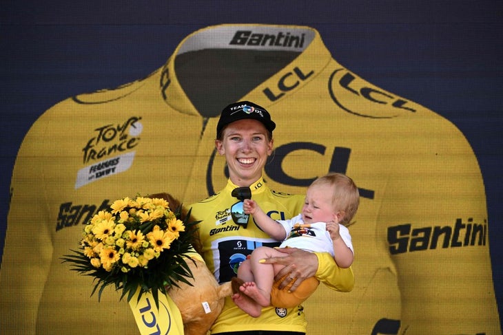 Lorena Wiebes on the podium with a friend's baby