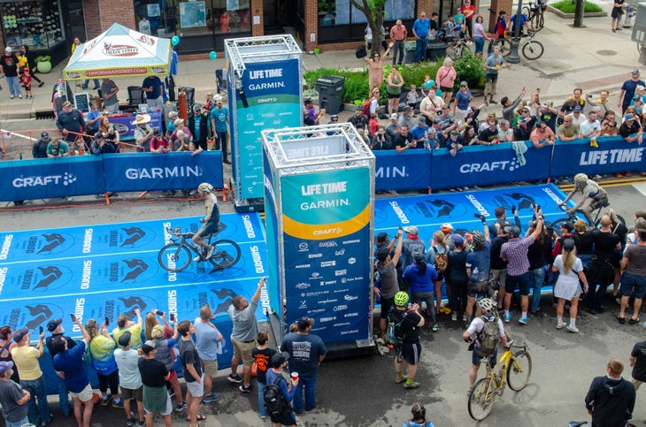 Ivar Slik crossing the finish line first at unbound gravel 2022 aerial shot