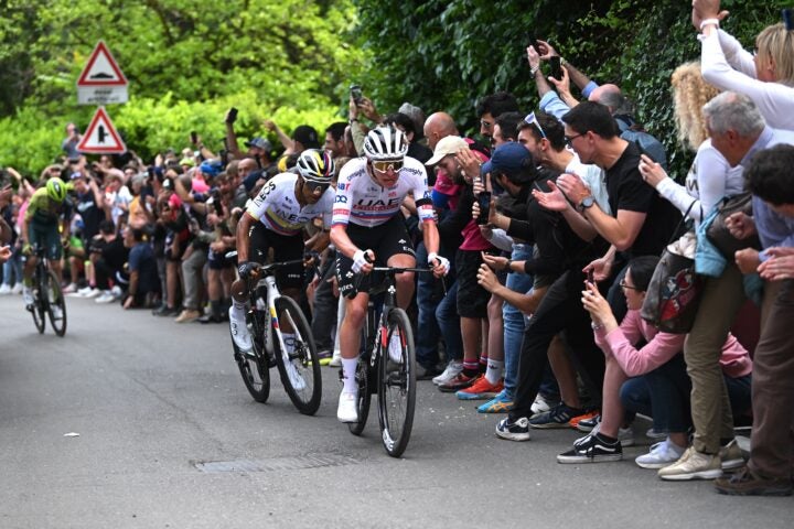 Jhonatan Narvaez of Ecuador and Team INEOS Grenadiers and Tadej Pogacar of Slovenia and UAE Team Emirates compete in the breakaway while fans cheer during the 107th Giro d'Italia 2024, Stage 1 a 140km stage from Venaria Reale to Torino / #UCIWT / on May 04, 2024 in Torino, Italy. (Photo by Dario Belingheri/Getty Images)