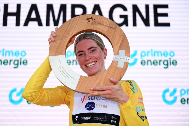 Demi Vollering of The Netherlands and Team SD Worx-Protime celebrates at podium as Yellow Leader Jersey and overall race winner during the 4th Tour de Suisse Women 2024, Stage 4 a 127.5km stage from Champagne to Champagne / #UCIWWT / on June 18, 2024 in Champagne, Switzerland. (Photo by Tim de Waele/Getty Images)