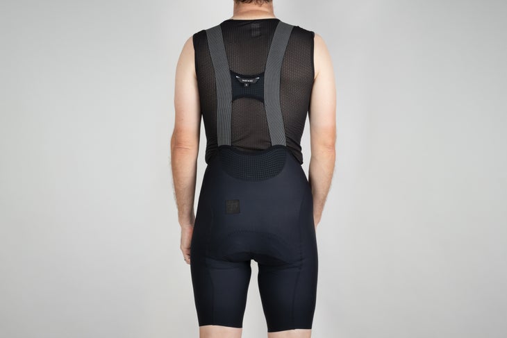 Rear view of bib shorts on white