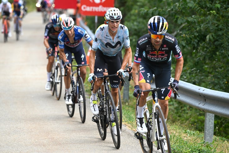 PUERTO DE ANCARES, SPAIN - AUGUST 30: (L-R) Enric Mas of Spain and Team Movistar and Primoz Roglic of Slovenia and Team Red Bull Bora - hansgrohe attack during the La Vuelta - 79th Tour of Spain 2024 - Stage 13 a 176km stage from Lugo to Puerto de Ancares 1659m / #UCIWT / on August 30, 2024 in Puerto de Ancares, Spain. (Photo by Dario Belingheri/Getty Images)