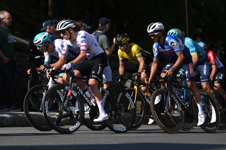 QUEBEC CITY, QUEBEC - SEPTEMBER 13: (L-R) Tadej Pogacar of Slovenia and UAE Team Emirates and Julian Alaphilippe of France and Team Soudal Quick-Step compete during the 13th Grand Prix Cycliste de Quebec 2024 a 201.6km one day race from Quebec City to Quebec City / #UCIWT / on September 13, 2024 in Quebec City, Quebec. (Photo by Alex Broadway/Getty Images)