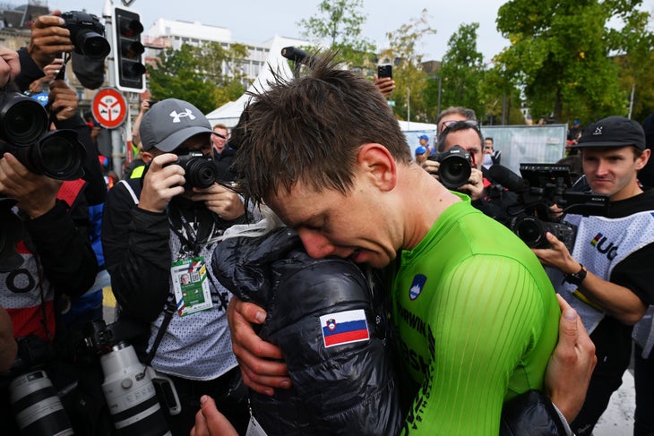 ZURICH, SWITZERLAND - SEPTEMBER 29: Gold medalist Tadej Pogacar of Team Slovenia (R) hugs his girlfriend Urska Zigart (L) during the 97th UCI Cycling World Championships Zurich 2024, Men's Elite Road Race a 273.9km one day race from Winterthur to Zurich on September 29, 2024 in Zurich, Switzerland. (Photo by Dario Belingheri/Getty Images)