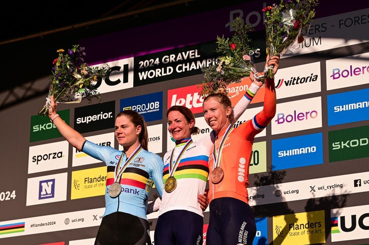 Marianne Vos (Netherlands) on the podium with Lotte Kopecky (Belgium) and Lorena Wiebes (Netherlands) at the gravel world championships (photo by Twila Muzzi)