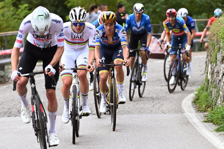 Pogačar Soloes to Win at Il Lombardia to Cap Near-Perfect Season 3 COMO, ITALY - OCTOBER 12: (L-R) Tadej Pogacar of Slovenia and UAE Team Emirates and Remco Evenepoel of Belgium and Team Soudal Quick-Step compete during the 118th Il Lombardia 2024 a 255km one day race from Bergamo to Como / #UCIWT / on October 12, 2024 in Como, Italy. (Photo by Tim de Waele/Getty Images)