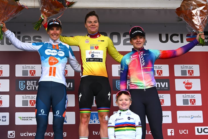 Lotte Kopecky Wins Cliffhanger Final Stage and Simac Ladies Tour 3 ARNHEM, NETHERLANDS - OCTOBER 13: (L-R) Franziska Koch of Germany and Team dsm-firmenich PostNL on second place, race winner Lotte Kopecky of Belgium and Team SD Worx - Protime - Yellow Leader Jersey and Zoe Backstedt of The United Kingdom and Team Canyon//SRAM Racing on third place pose on the podium ceremony after the 26th Simac Ladies Tour 2024, Stage 6 a 145.8km stage from Arnhem to Arnhem / #UCIWWT / on October 13, 2024 in Arnhem, Netherlands. (Photo by Luc Claessen/Getty Images)