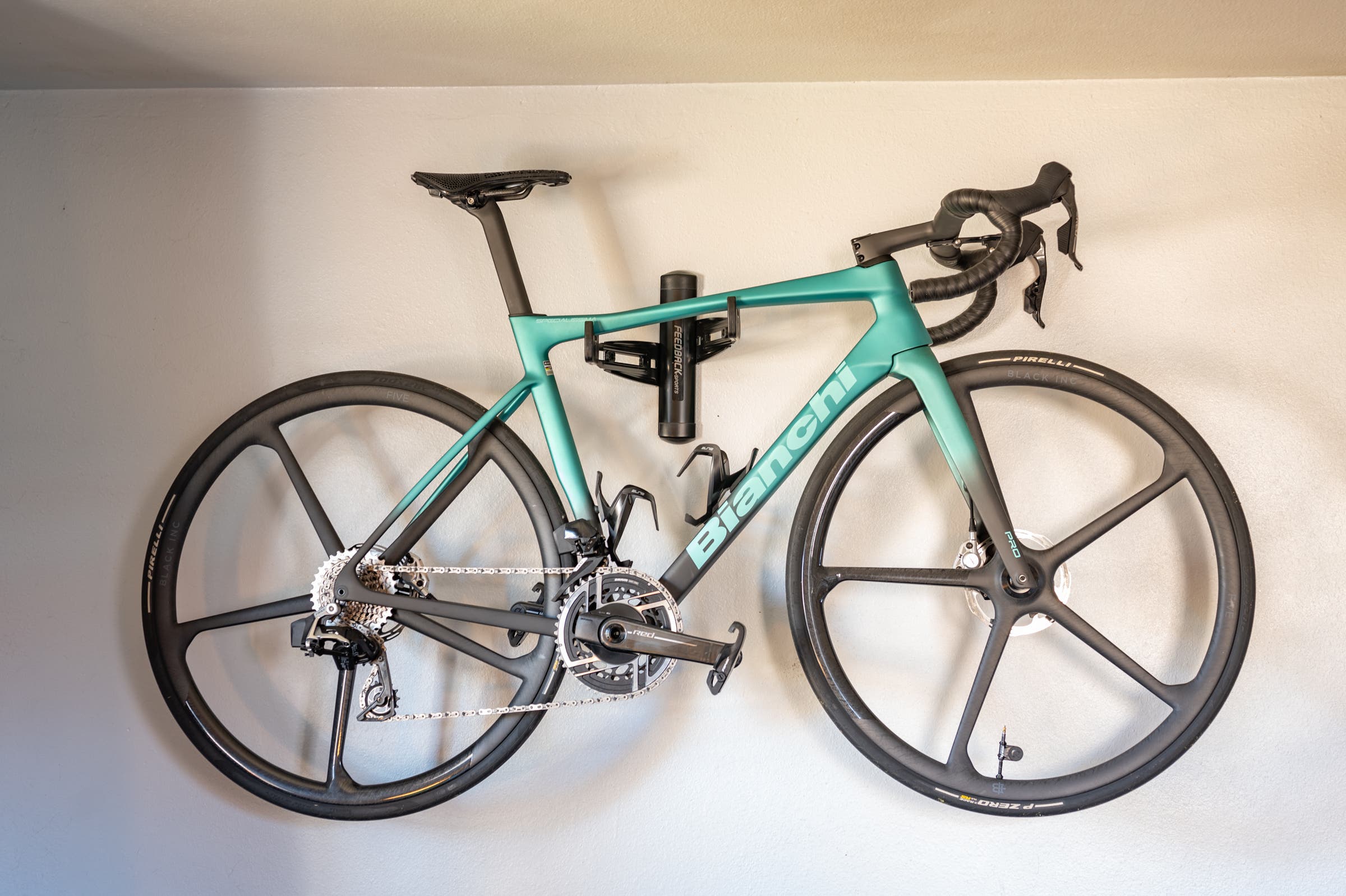 bianchi specialissima sitting on a Feedback Sports Velo Wall Rack 2D