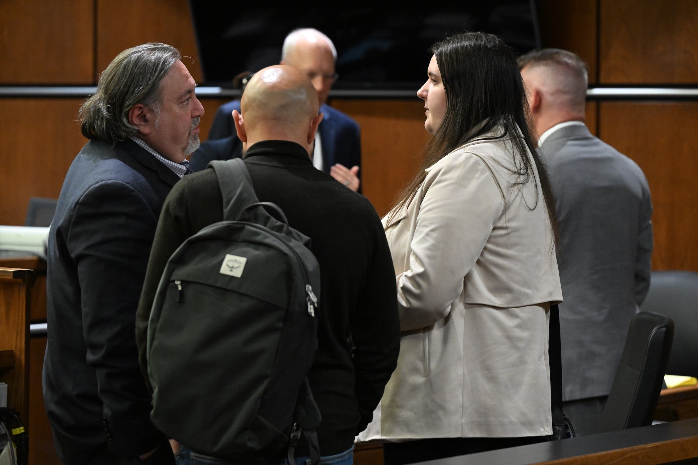 BOULDER, CO - MARCH 31: Yeva Smilianska, right, talks with her lawyer Timur Kishinevsky, left, after the first day of proceedings in her trial at the Boulder County Courthouse in Boulder, Colorado on March 31, 2025. Yeva Smilianska faces charges of vehicular homicide for striking and killing competitive cyclist Magnus White in 2023, Jury selection and opening arguments started today after months of postponement. Smilianska is accused of hitting the 17-year-old rising star from behind and killing him. White was training for an international competition. (Photo by Helen H. Richardson/MediaNews Group/The Denver Post via Getty Images)