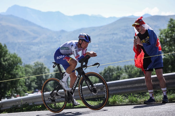 Red Bull - BORA - hansgrohe team's Slovenian rider Primoz Roglic cycles during the 13th stage of the 112th edition of the Tour de France cycling race, 10.9 km individual time trial between Loudenvielle and Peyragudes, in the Pyrenees mountains of southwestern France, on July 18, 2025. (Photo by Anne-Christine POUJOULAT / AFP)