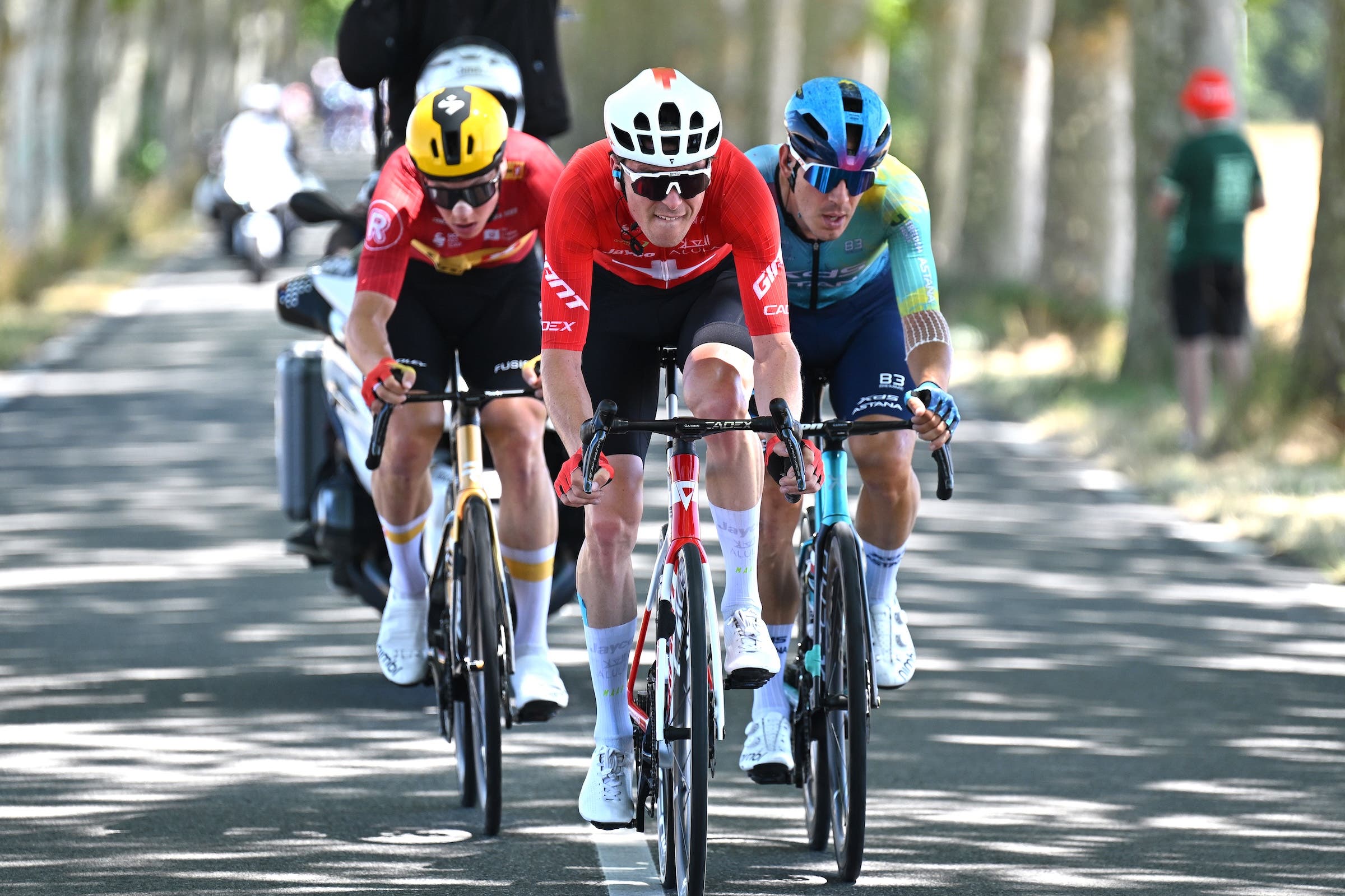 TOULOUSE, FRANCE - JULY 16: (L-R) Jonas Abrahamsen of Norway and Team Uno-X Mobility, Mauro Schmid of Switzerland and Team Jayco AlUla and Davide Ballerini of Italy and Team XDS Astana compete in the breakaway during the 112th Tour de France 2025, Stage 11 a 156.8km stage from Toulouse to Toulouse / #UCIWT / on July 16, 2025 in Toulouse, France. (Photo by Tim de Waele/Getty Images)
