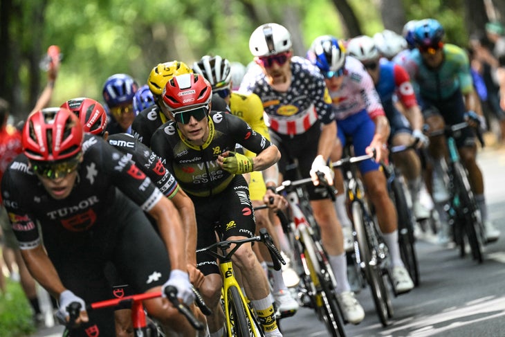 Team Visma - Lease a bike team's Danish rider Jonas Vingegaard cycles with the pack of riders (peloton) during the 15th stage of the 112th edition of the Tour de France cycling race, 169.3 km between Muret and Carcassonne, southwestern France, on July 20, 2025. (Photo by Loic VENANCE / AFP)