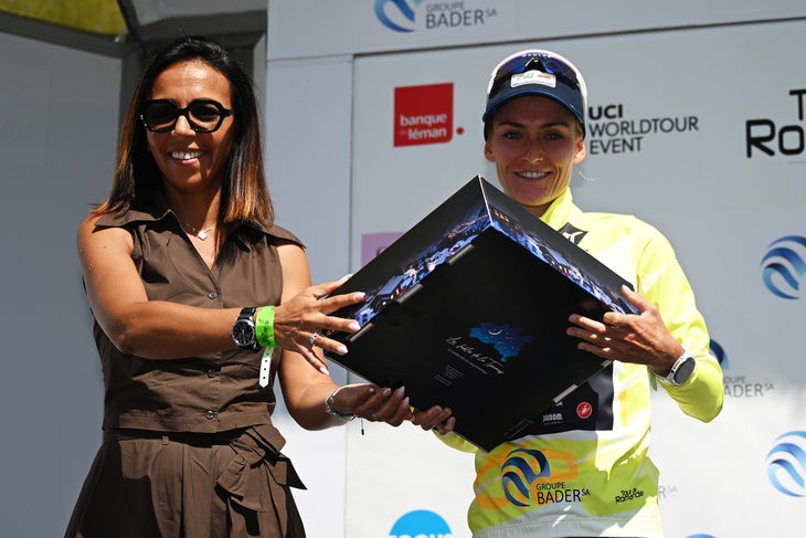 LA TZOUMAZ, SWITZERLAND - AUGUST 16: (L-R) Amina Lanaya, General Director, International Cycling Union (UCI) and Urska Zigart of Slovenia and Team AG Insurance - Soudal - Yellow Leader Jersey at podium during the 4th Tour de Romandie Feminin 2025, Stage 2 a 123.2km stage from Conthey to La Tzoumaz 1522m / #UCIWWT / on August 16, 2025 in La Tzoumaz, Switzerland. (Photo by Dario Belingheri/Getty Images)