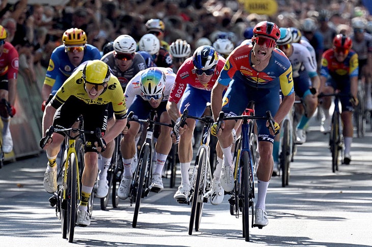 21 August 2025, North Rhine-Westphalia, Herford: Cycling, Deutschland Tour, Essen - Herford (202.60 km), 1st stage, Matthew Brennan (l) from Great Britain from Team Visma-Lease-a-Bike wins the stage ahead of Jonathan Milan (r) from Italy from Team Lidl-Trek. Photo: Federico Gambarini/dpa (Photo by Federico Gambarini/picture alliance via Getty Images)