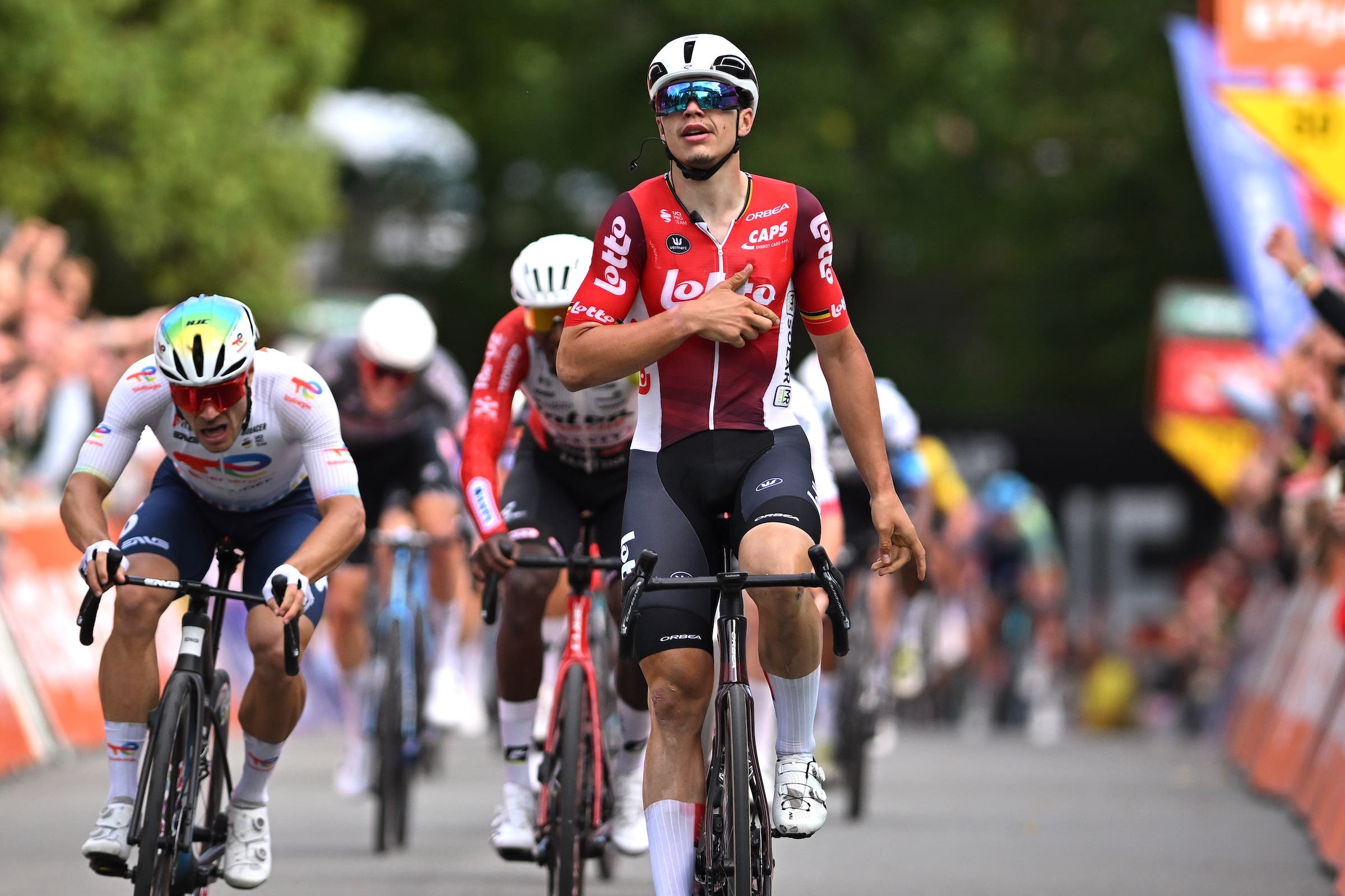 Arnaud De Lie of Belgium and Team Lotto celebrates at finish line as race winner ahead of Emilien Jeanniere of France and Team TotalEnergies (L) during the 65th Grand Prix de Wallonie 2025 a 187.1km one day race from Dison to Namur on September 17, 2025 in Namur, Belgium. (Photo: Luc Claessen/Getty Images)