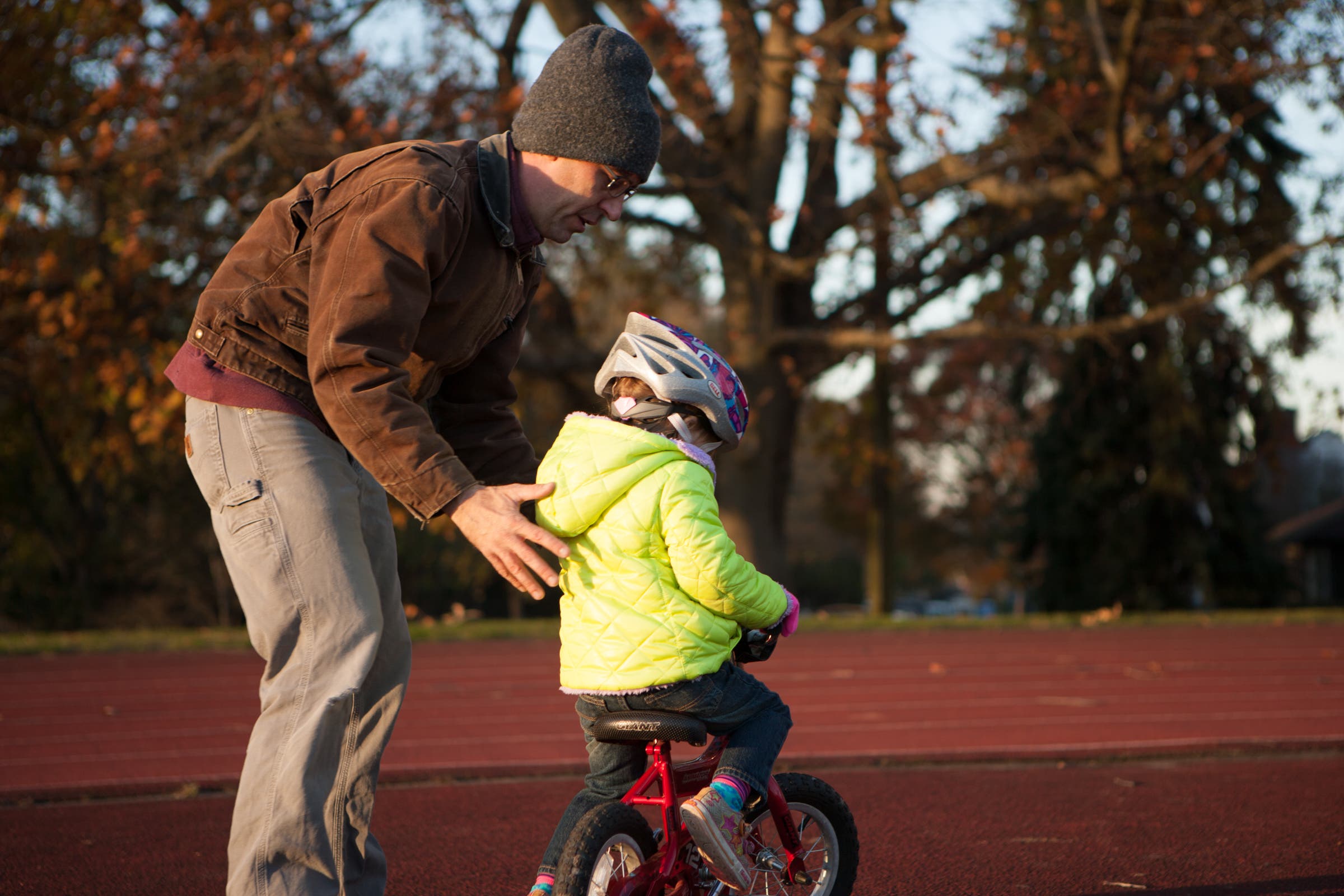 child learning to ride a bike
