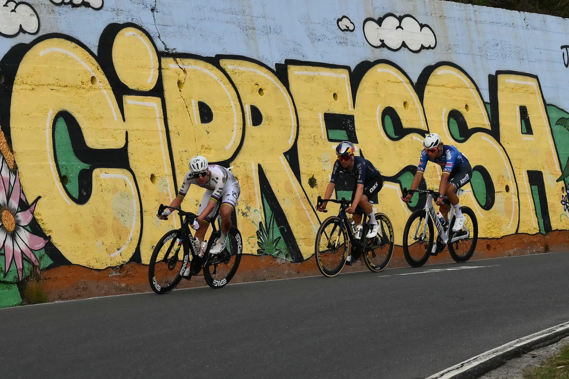 UAE Team Emirate's Tadej Pogacar leads Tom Pidcock (Pinarello Q36.5 Pro Cycling) and Mathieu van der Poel (Alpecin-Deceuninck) on the descent of the Cipressa (Photo: Marco Bertorello / AFP via Getty Images)