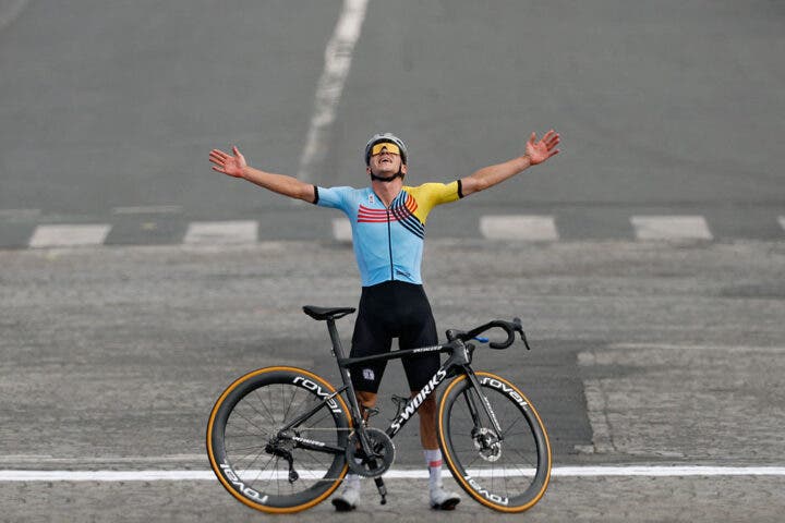 Belgium's Remco Evenepoel celebrates after crossing the finish line to win the men's cycling road race during the Paris 2024 Olympic Games in Paris, on August 3, 2024. (Photo by Odd ANDERSEN / AFP) (Photo by ODD ANDERSEN/AFP via Getty Images)