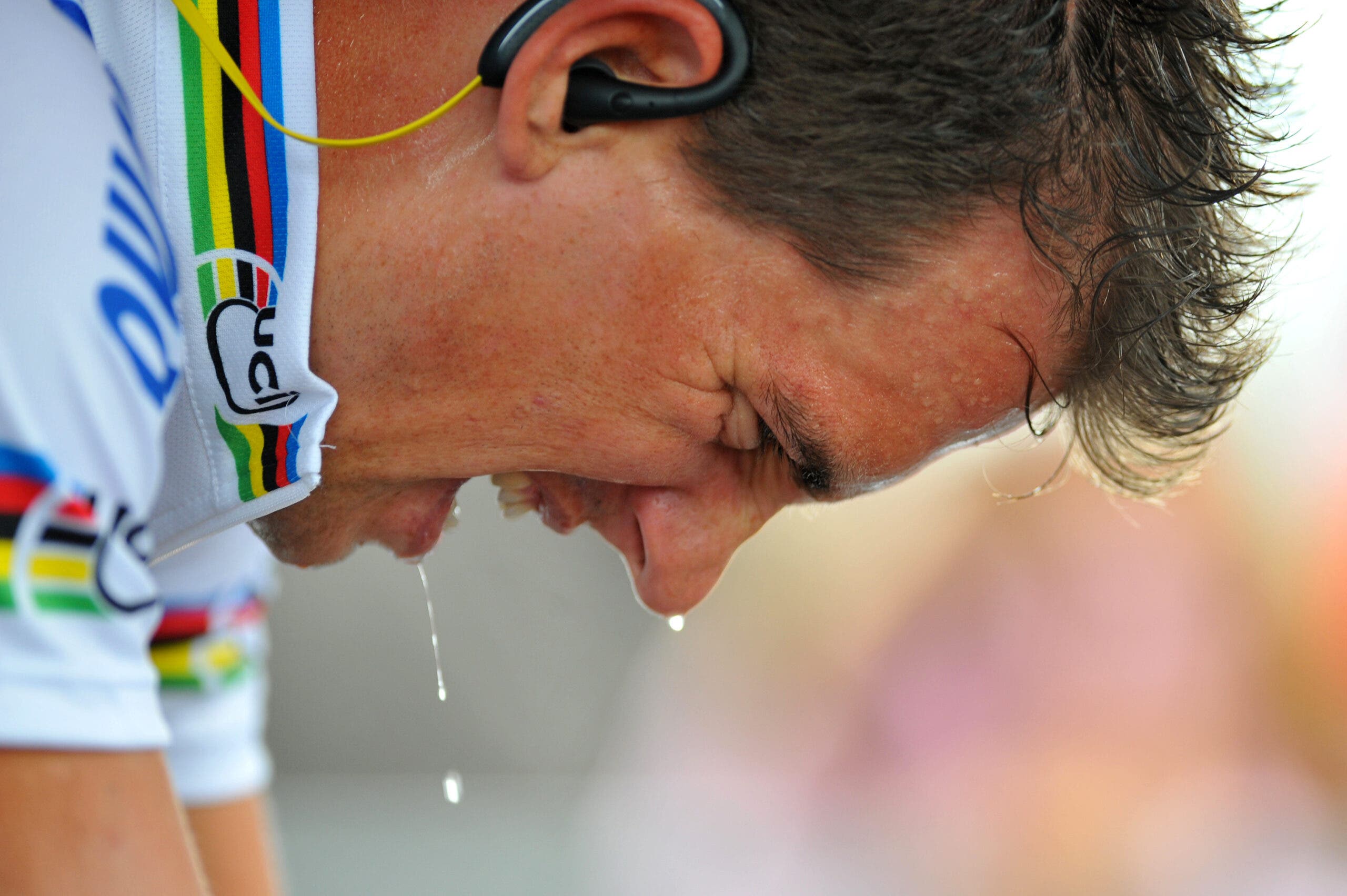 a cyclist sweats while riding on a trainer.